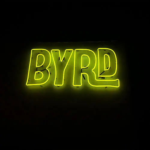 Custom BYRD neon sign in yellow for brand visibility